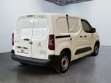 a white van that is parked in a room