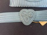 a belt with a heart on it and a belt with a heart on it