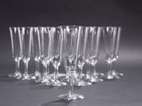 several empty wine glasses are lined up in a row on a table