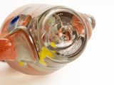 a close up of a glass bottle with a handle