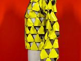 a mannequin mannequin with yellow and black triangles on it