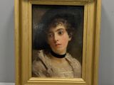 portrait of a young woman in a white dress by a gold frame