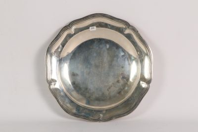 a silver plate on a white table with a mirror