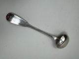 a spoon that is sitting on top of a table