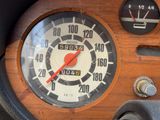 a close up of a speedometer in a car