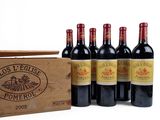 six bottles of red wine in a wooden crate on a white background