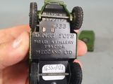 a person holding a small toy truck in their hand