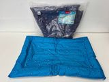 a close up of a blue blanket and a blue pillow on a counter