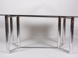 an image of a glass and chrome dining table