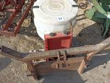 a picture of an old farm equipment that is sitting on the ground