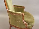 an image of a green chair sitting on top of a white floor