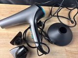 an image of a hair dryer and other items on a table
