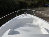 a boat that is parked on the side of the road