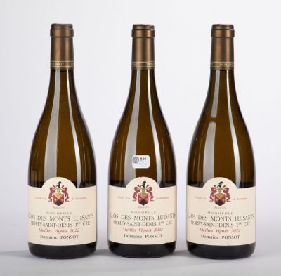 three bottles of wine sitting next to each other on a table