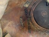 a close up view of a rusted gas mask