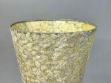 a glass vase that is sitting on top of a table