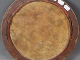 a brown plate with a brown rim on a gray surface