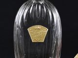 a bottle of liquor and a box of chocolates on a table
