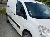 the white van is parked on the side of the road