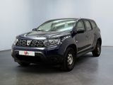 a picture of a blue pick up truck parked in a showroom