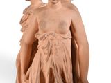 statue of a man and a woman holding hands on a white background