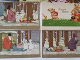 four christmas cards with pictures of people and animals in the snow