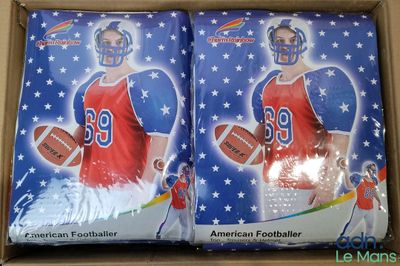 two boxes of american football cards are in a cardboard box