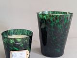 two green and black vases sitting next to each other on a table
