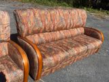 two couches that are sitting in the parking lot