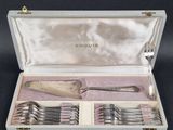 silverware in a case with a spoon and fork inside of it