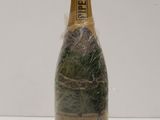 an image of a bottle of champagne wrapped in a plastic wrap