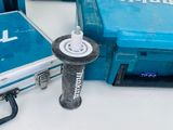 several makita tools are sitting on a white surface