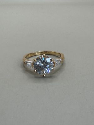 a close up of a ring on a table with a white background