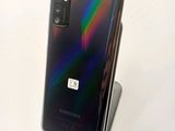 the back of the samsung note 10 lite is shown with a rainbow - colored back