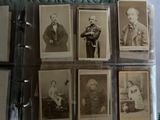 several old black and white photographs of men and women in a glass case