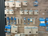 a display of electronic devices on the wall in a store