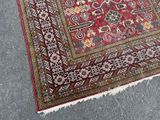 a rug on the ground with a cat laying on it