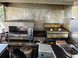 an image of a commercial kitchen with stainless steel appliances