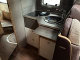 a small kitchen in the back of a camper