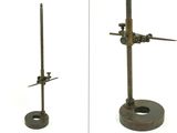 two different views of a clock on a stand