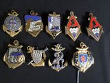 a lot of badges that are on a black surface
