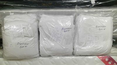 four bags of toilet paper wrapped in plastic