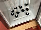 a small refrigerator with a bunch of wires in it