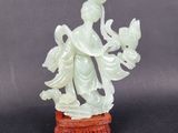 chinese carved jade figurine of a woman holding a bird