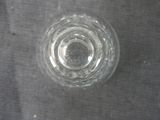 a glass of water sitting on a table