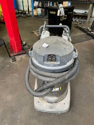a machine that is sitting on a stand in a garage