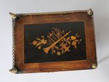 a picture of a wooden box with a design on it