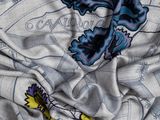 a close up of a fabric with a butterfly design on it