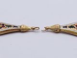 a pair of gold and enamel earrings