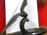 a sculpture of a bird that is sitting on a table